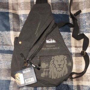 ModelCo Charcoal Sling Backpack with Lion Design